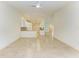 Clean kitchen with white cabinets and granite countertops at 5372 Pamela Wood Way # 7, Sarasota, FL 34233
