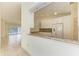 Kitchen features granite countertops and a breakfast bar at 5372 Pamela Wood Way # 7, Sarasota, FL 34233