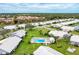 Aerial view of community pool and surrounding homes at 5372 Pamela Wood Way # 7, Sarasota, FL 34233