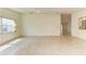 Bright living room with tile floors and large windows at 5372 Pamela Wood Way # 7, Sarasota, FL 34233