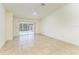 Living room with tiled floors and access to patio at 5372 Pamela Wood Way # 7, Sarasota, FL 34233