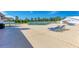 Relaxing community pool with lounge chairs and tennis courts at 5372 Pamela Wood Way # 7, Sarasota, FL 34233
