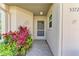 Inviting front door entrance with landscaping at 5372 Pamela Wood Way # 7, Sarasota, FL 34233