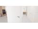 View of hallway leading to kitchen and bathroom at 4950 Remington Dr # 401, Sarasota, FL 34234