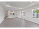 Open living area with grey tile floors and recessed lighting at 4769 Tortona Ct, Bradenton, FL 34211