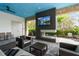 Relaxing outdoor lounge area with fireplace and TV at 4769 Tortona Ct, Bradenton, FL 34211