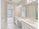 Spacious bathroom with double vanity and large mirror at 4769 Tortona Ct, Bradenton, FL 34211