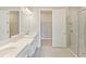 Bathroom with double vanity and walk-in shower at 4769 Tortona Ct, Bradenton, FL 34211