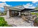 Outdoor Bahama Bar with seating and umbrellas at 4769 Tortona Ct, Bradenton, FL 34211