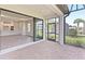 Open lanai with sliding glass doors leading to the kitchen and backyard at 4769 Tortona Ct, Bradenton, FL 34211