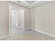 Bedroom with access to bathroom and tile flooring at 4769 Tortona Ct, Bradenton, FL 34211