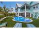 Relax by the freeform pool and putting green in this private backyard setting at 118 Mangrove Ave, Anna Maria, FL 34216