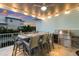 Outdoor kitchen and dining area with sunset view at 118 Mangrove Ave, Anna Maria, FL 34216