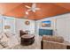 Gathering room with vaulted ceiling, wood-paneled ceiling and comfy seating at 118 Mangrove Ave, Anna Maria, FL 34216