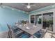 Enjoy meals outdoors under the covered patio with seating for six at 118 Mangrove Ave, Anna Maria, FL 34216