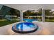 Private pool and spa with mosaic tile detail at 118 Mangrove Ave, Anna Maria, FL 34216