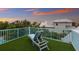 Relaxing rooftop deck with artificial turf and lounge chair at 118 Mangrove Ave, Anna Maria, FL 34216