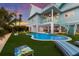 Enjoy this spacious backyard with pool and patio area at 118 Mangrove Ave, Anna Maria, FL 34216