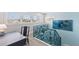 Light and airy landing with built-in desk and unique railing at 118 Mangrove Ave, Anna Maria, FL 34216