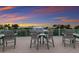 Rooftop deck with seating area and sunset view at 118 Mangrove Ave, Anna Maria, FL 34216