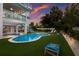 Backyard oasis with pool, hot tub, and outdoor games at 118 Mangrove Ave, Anna Maria, FL 34216