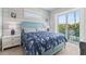 Spacious bedroom with blue walls and balcony access at 118 Mangrove Ave, Anna Maria, FL 34216