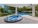 Relax and unwind in this private hot tub with surrounding patio at 118 Mangrove Ave, Anna Maria, FL 34216