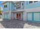 Front entrance with double doors and unique artistic accents at 118 Mangrove Ave, Anna Maria, FL 34216