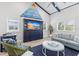 Living room features a large navy blue media console and coastal-themed artwork at 118 Mangrove Ave, Anna Maria, FL 34216