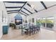 Open concept dining room and living area with vaulted ceilings and coastal decor at 118 Mangrove Ave, Anna Maria, FL 34216