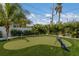 Enjoy your own private putting green in the backyard at 118 Mangrove Ave, Anna Maria, FL 34216