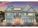 Charming two-story home with light blue exterior at 118 Mangrove Ave, Anna Maria, FL 34216