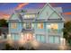 Beautiful beach-style home with double garage and large windows at 118 Mangrove Ave, Anna Maria, FL 34216