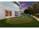 Putting green in the backyard near the house at 118 Mangrove Ave, Anna Maria, FL 34216
