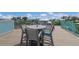 Enjoy city views from this rooftop deck, complete with seating and a table for dining al fresco at 118 Mangrove Ave, Anna Maria, FL 34216