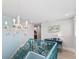 Elegant staircase with a coastal-themed railing and chandelier at 118 Mangrove Ave, Anna Maria, FL 34216
