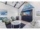 Living room with vaulted ceilings, coastal decor, and a large sectional sofa at 118 Mangrove Ave, Anna Maria, FL 34216