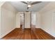 Bright bedroom with hardwood floors and double doors to closets at 7754 Westmoreland Dr, Sarasota, FL 34243