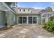 Home features a large patio with double sliding glass doors at 7754 Westmoreland Dr, Sarasota, FL 34243