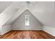 Bedroom with hardwood floors, a window, and ceiling fan at 7754 Westmoreland Dr, Sarasota, FL 34243