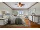 Main bedroom with hardwood floors and ceiling fan at 7754 Westmoreland Dr, Sarasota, FL 34243