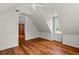 Bedroom with hardwood floors, a window, and ceiling fan at 7754 Westmoreland Dr, Sarasota, FL 34243