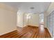 Bedroom with hardwood floors, built-in shelving, and extra room at 7754 Westmoreland Dr, Sarasota, FL 34243