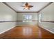 Bright bedroom with hardwood floors and ceiling fan at 7754 Westmoreland Dr, Sarasota, FL 34243
