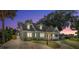 House exterior at dusk, showcasing its architectural details at 7754 Westmoreland Dr, Sarasota, FL 34243