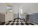 Unfinished basement area with utility sink and checkerboard floor at 7754 Westmoreland Dr, Sarasota, FL 34243