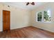 Charming bedroom with hardwood floors and window at 7754 Westmoreland Dr, Sarasota, FL 34243