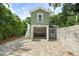 Detached garage with paver driveway, and checkerboard floor at 7754 Westmoreland Dr, Sarasota, FL 34243