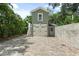 Detached garage with paver driveway and charming exterior at 7754 Westmoreland Dr, Sarasota, FL 34243
