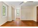 Charming bedroom with hardwood floors, a window, and ceiling fan at 7754 Westmoreland Dr, Sarasota, FL 34243